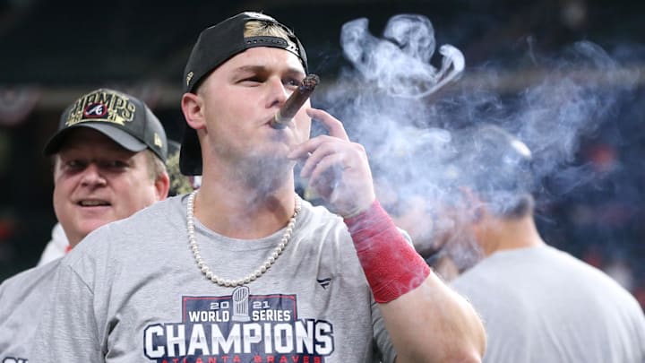 Nov 2, 2021; Houston, TX, USA; Atlanta Braves right fielder Joc Pederson smokes a cigar after defeating the Houston Astros in game six of the 2021 World Series at Minute Maid Park. Mandatory Credit: Troy Taormina-Imagn Images