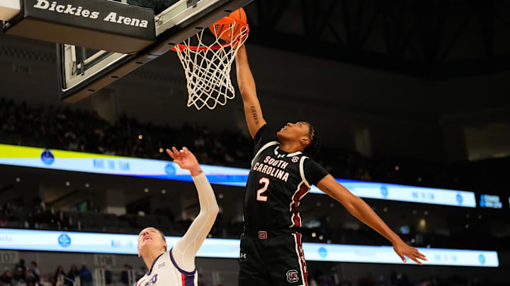 Dec 8, 2024; Fort Worth, Texas, USA;  South Carolina Gamecocks forward Ashlyn Watkins (2) dunks the ball against TCU Horned Frogs center Sedona Prince (13) during the first half at Dickies Arena. Mandatory Credit: Chris Jones-Imagn Images