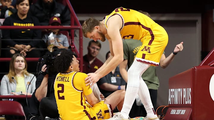Nov 9, 2024; Minneapolis, Minnesota, USA; Minnesota Golden Gophers guard Mike Mitchell Jr. (2) grabs his leg after an injury during the second half against the Omaha Mavericks at Williams Arena. Mandatory Credit: Matt Krohn-Imagn Images Nov 9, 2024; Minneapolis, Minnesota, USA; Minnesota Golden Gophers guard Mike Mitchell Jr. (2) grabs his leg after an injury during the second half against the Omaha Mavericks at Williams Arena. Mandatory Credit: Matt Krohn-Imagn Images