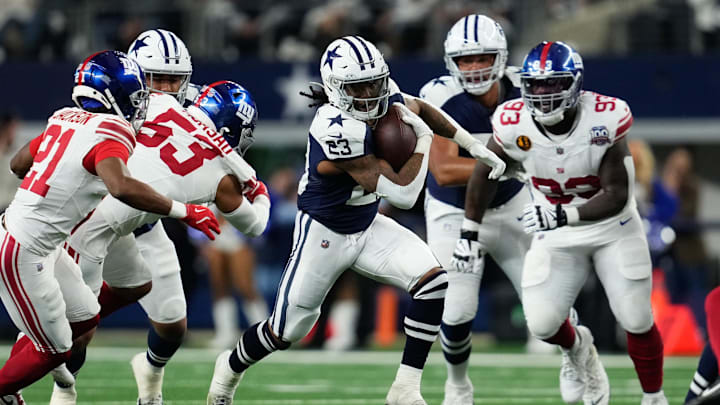 Nov 28, 2024; Arlington, Texas, USA; Dallas Cowboys running back Rico Dowdle (23) runs the ball as New York Giants cornerback Adoree' Jackson (21) defends during the first half at AT&T Stadium. Mandatory Credit: Chris Jones-Imagn Images Nov 28, 2024; Arlington, Texas, USA; Dallas Cowboys running back Rico Dowdle (23) runs the ball as New York Giants cornerback Adoree' Jackson (21) defends during the first half at AT&T Stadium. Mandatory Credit: Chris Jones-Imagn Images