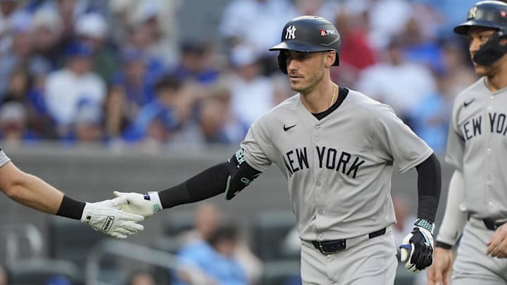 Oct 5, 2025; Toronto, Ontario, CAN; New York Yankees Cody Bellinger (35) is congratulated after hitting a two-run home run in the sixth inning against the Toronto Blue Jays during game two of the ALDS round for the 2025 MLB playoffs at Rogers Centre. Mandatory Credit: John E. Sokolowski-Imagn Images Oct 5, 2025; Toronto, Ontario, CAN; New York Yankees Cody Bellinger (35) is congratulated after hitting a two-run home run in the sixth inning against the Toronto Blue Jays during game two of the ALDS round for the 2025 MLB playoffs at Rogers Centre. Mandatory Credit: John E. Sokolowski-Imagn Images