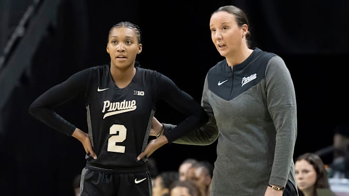 Purdue head coach Katie Gearlds, right, talks to Purdue guard Rashunda Jones 