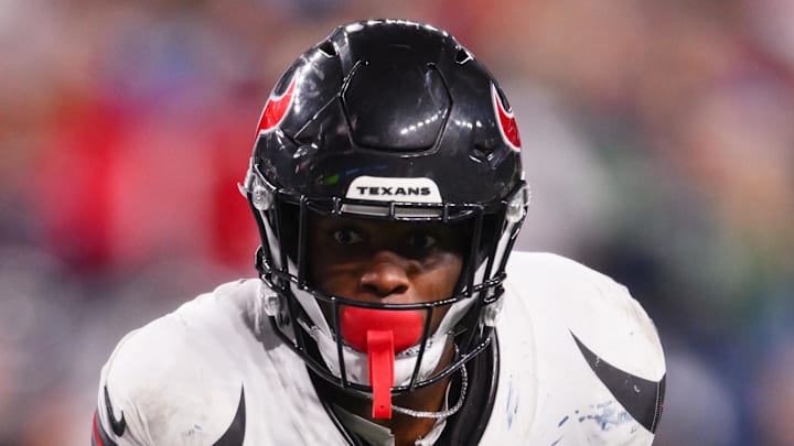 Houston Texans running back Woody Marks (27) runs the ball during the fourth quarter against the Seattle Seahawks at Lumen Field. 