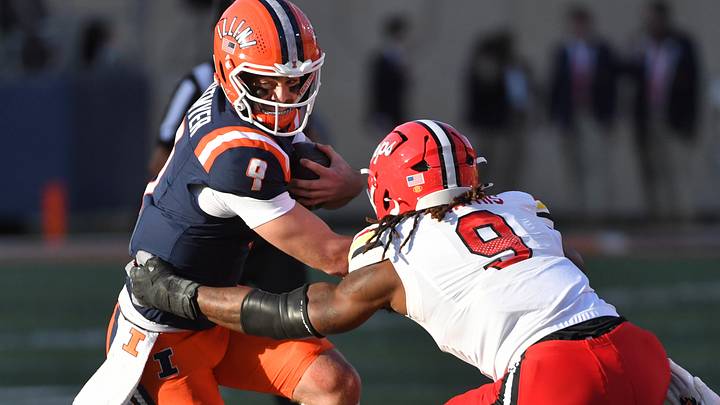 Nov 15, 2025; Champaign, Illinois, USA; Illinois Fighting Illini quarterback Luke Altmyer runs with the football as Maryland Terrapins defensive lineman Zahir Mathis rushes him during the first half against the Maryland Terrapins at Memorial Stadium. Photo by Ron Johnson Nov 15, 2025; Champaign, Illinois, USA; Illinois Fighting Illini quarterback Luke Altmyer runs with the football as Maryland Terrapins defensive lineman Zahir Mathis rushes him during the first half against the Maryland Terrapins at Memorial Stadium. Photo by Ron Johnson