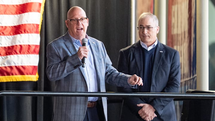 Apr 15, 2025; Saint Paul, Minnesota, USA; Prior to the game between the Minnesota Wild and Anaheim Ducks, Bob Motzko is announced as the head coach for the 2026 IIHF World Junior Hockey Championship by John Vanbiesbrouck (right). The ceremony was held at Xcel Energy Center. Mandatory Credit: Matt Blewett-Imagn Images