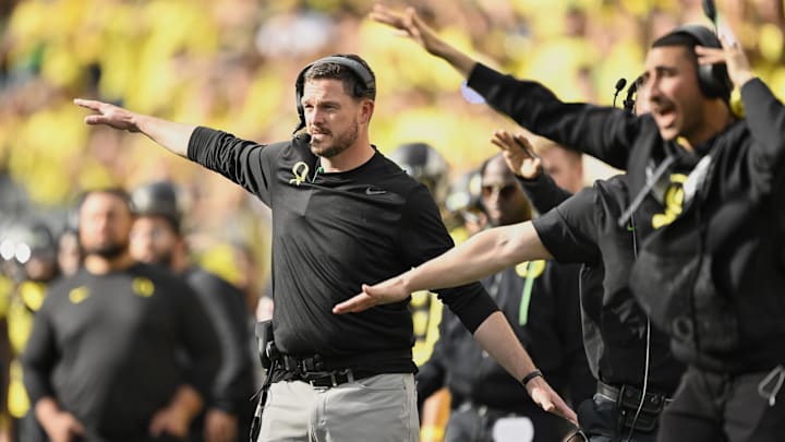 Oct 26, 2024; Eugene, Oregon, USA; Oregon Ducks head coach Dan Lanning signals to the defense during the second half against the Illinois Fighting Illini at Autzen Stadium.