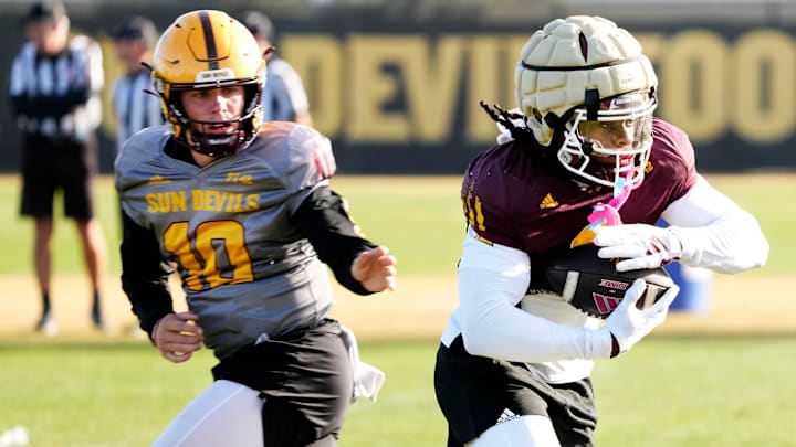 Arizona State Sun Devils quarterback Sam Leavitt (10) hands the ball to running back Kyson Brown (2) during workouts at Kajikawa Practice fields on Dec. 20, 2024. Arizona State Sun Devils quarterback Sam Leavitt (10) hands the ball to running back Kyson Brown (2) during workouts at Kajikawa Practice fields on Dec. 20, 2024.