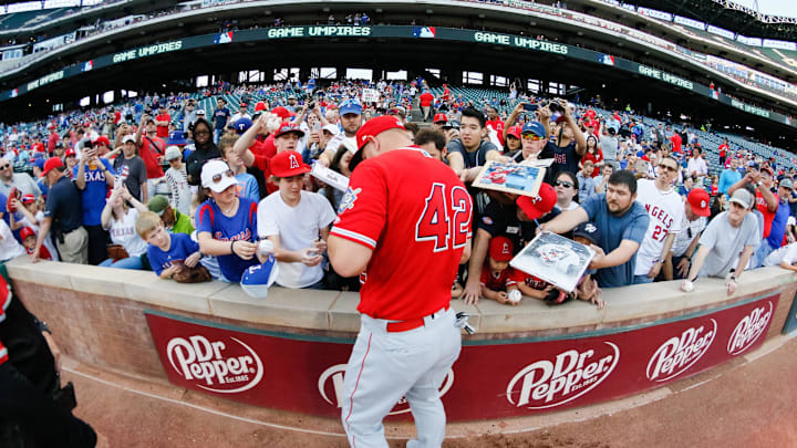 Apr 15, 2019; Arlington, TX, USA; Los Angeles Angels center fielder Mike Trout signs autographs on Jackie Robinson Day prior to a game against the Texas Rangers at Globe Life Park in Arlington. Mandatory Credit: Ray Carlin-Imagn Images Apr 15, 2019; Arlington, TX, USA; Los Angeles Angels center fielder Mike Trout signs autographs on Jackie Robinson Day prior to a game against the Texas Rangers at Globe Life Park in Arlington. Mandatory Credit: Ray Carlin-Imagn Images