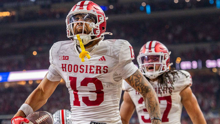 Indiana's Elijah Sarratt (13) celebrates a touchdown catch during the Indiana versus Ohio State BIg Ten Championship football game at Lucas Oil Stadium on Saturday, Dec. 6, 2025.