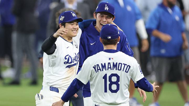 Oct 27, 2025; Los Angeles, California, USA; Los Angeles Dodgers designated hitter Shohei Ohtani (17) celebrates with pitcher Roki Sasaki (11) and pitcher Yoshinobu Yamamoto (18) after winning in the eighteenth inning against the Toronto Blue Jays in game three of the 2025 MLB World Series at Dodger Stadium. Mandatory Credit: Kiyoshi Mio-Imagn Images Oct 27, 2025; Los Angeles, California, USA; Los Angeles Dodgers designated hitter Shohei Ohtani (17) celebrates with pitcher Roki Sasaki (11) and pitcher Yoshinobu Yamamoto (18) after winning in the eighteenth inning against the Toronto Blue Jays in game three of the 2025 MLB World Series at Dodger Stadium. Mandatory Credit: Kiyoshi Mio-Imagn Images