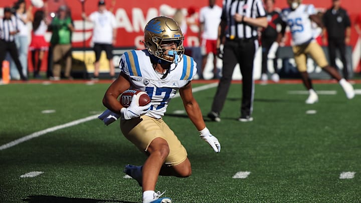 Sep 23, 2023; Salt Lake City, Utah, USA; UCLA Bruins wide receiver Logan Loya (17) runs with the ball after a catch against the Utah Utes in the fourth quarter at Rice-Eccles Stadium. Mandatory Credit: Rob Gray-Imagn Images Sep 23, 2023; Salt Lake City, Utah, USA; UCLA Bruins wide receiver Logan Loya (17) runs with the ball after a catch against the Utah Utes in the fourth quarter at Rice-Eccles Stadium. Mandatory Credit: Rob Gray-Imagn Images