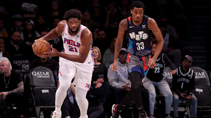 Nov 19, 2023; Brooklyn, New York, USA; Philadelphia 76ers center Joel Embiid (21) brings the ball up