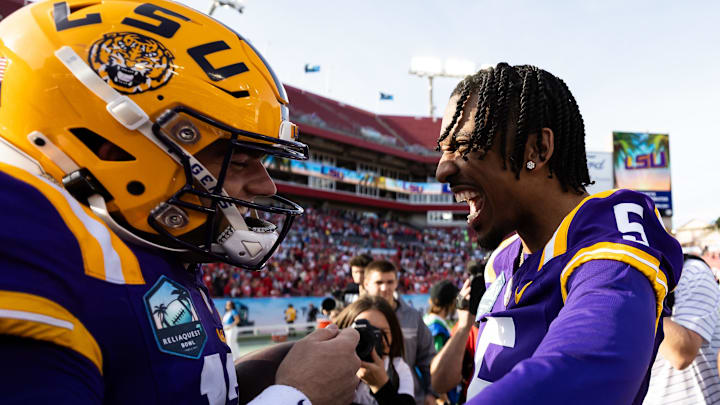 Jan 1, 2024; Tampa, FL, USA; LSU Tigers quarterbacks Garrett Nussmeier, left, and Jayden Daniels (5)