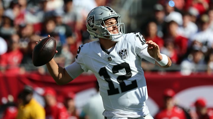 Dec 8, 2024; Tampa, Florida, USA; Las Vegas Raiders quarterback Aidan O'Connell (12) throws the ball during the first half against the Tampa Bay Buccaneers at Raymond James Stadium. Mandatory Credit: Kim Klement Neitzel-Imagn Images