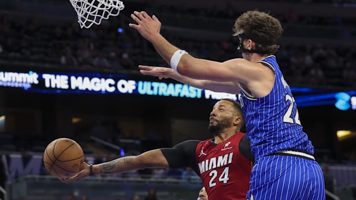 Dec 5, 2025; Orlando, Florida, USA; Miami Heat guard Norman Powell (24) shoots the ball under Orlando Magic forward Franz Wagner (22) in the first quarter at Kia Center. Mandatory Credit: Nathan Ray Seebeck-Imagn Images Dec 5, 2025; Orlando, Florida, USA; Miami Heat guard Norman Powell (24) shoots the ball under Orlando Magic forward Franz Wagner (22) in the first quarter at Kia Center. Mandatory Credit: Nathan Ray Seebeck-Imagn Images