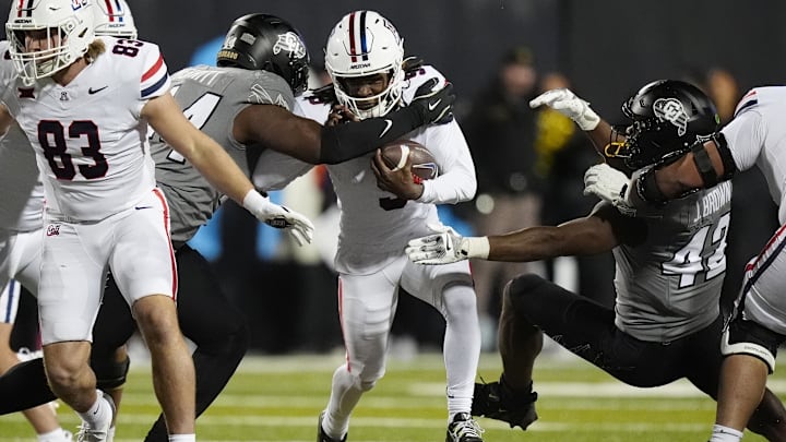 Nov 1, 2025; Boulder, Colorado, USA; Arizona Wildcats wide receiver Gio Richardson (5) carries the ball in the second half against the Colorado Buffaloes at Folsom Field. Mandatory Credit: Ron Chenoy-Imagn Images