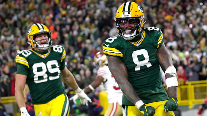 Green Bay Packers running back Josh Jacobs (8) celebrates scoring a touchdown in the third quarter against the San Francisco 49ers during their football game Sunday, November 24, 2024, at Lambeau Field in Green Bay, Wisconsin. Green Bay Packers running back Josh Jacobs (8) celebrates scoring a touchdown in the third quarter against the San Francisco 49ers during their football game Sunday, November 24, 2024, at Lambeau Field in Green Bay, Wisconsin.