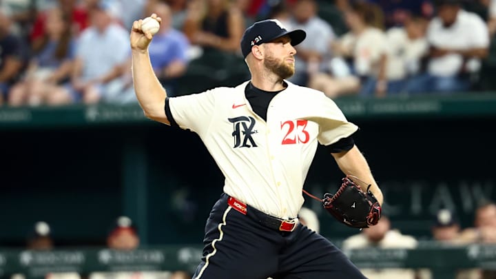 Sep 5, 2025; Arlington, Texas, USA;  Texas Rangers starting pitcher Merrill Kelly (23) throws during the second inning against the Houston Astros at Globe Life Field. Mandatory Credit: Kevin Jairaj-Imagn Images