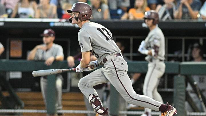 Jun 24, 2024; Omaha, NE, USA;  Texas A&M Aggies left fielder Caden Sorrell (13) doubles in a run against the Tennessee Volunteers during the 2024 CWS. Mandatory Credit: Steven Branscombe-Imagn Images
