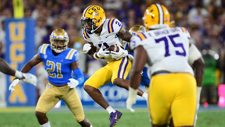 Sep 4, 2021; Pasadena, California, USA; Louisiana State Tigers wide receiver Koy Moore (2) catches a pass against the UCLA Bruins during the second half the at the Rose Bowl. Mandatory Credit: Gary A. Vasquez-Imagn Images