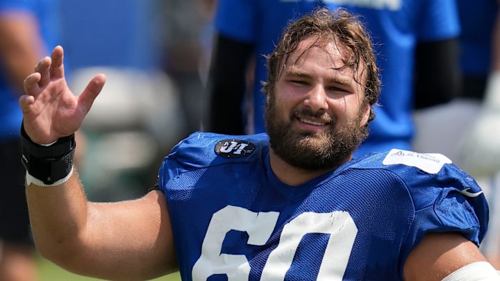 Indianapolis Colts center Tanor Bortolini (60) warms up Thursday, Aug. 14, 2025, at a joint practice with the Green Bay Packers during training camp at Grand Park in Westfield.