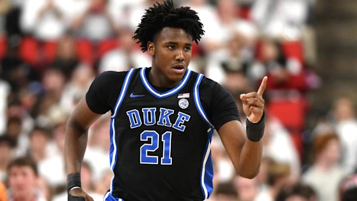 Mar 2, 2026; Raleigh, North Carolina, USA;  Duke Blue Devils center Patrick Ngongba II (21) reacts after scoring against the NC State Wolfpack during the first half at Lenovo Center. Mandatory Credit: Zachary Taft-Imagn Images