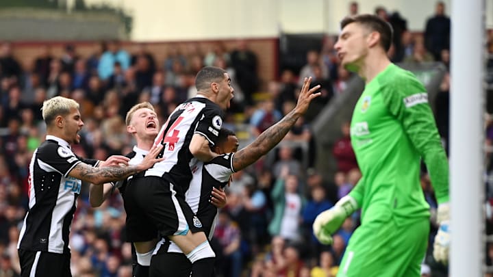 Newcastle players celebrate their second goal to the despair of Nick Pope