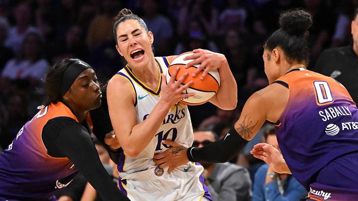 Aug 26, 2025; Los Angeles, California, USA; Los Angeles Sparks guard Kelsey Plum (10) is defended by Phoenix Mercury guard Kahleah Copper (2) and forward Satou Sabally (0) during the second half at Crypto.com Arena. Mandatory Credit: Jayne Kamin-Oncea-Imagn Images