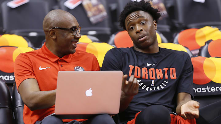 Jan 13, 2018; Toronto, Ontario, CAN; Toronto Raptors     assistant coach Patrick Mutombo (left) and Toronto Raptors forward OG Anunoby (right) talk prior to a game against the Golden State Warriors at the Air Canada Centre. Mandatory Credit: John E. Sokolowski-Imagn Images