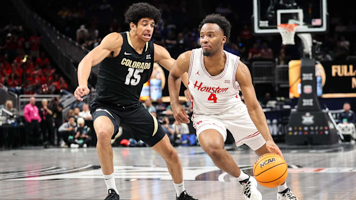 Mar 13, 2025; Kansas City, MO, USA; Houston Cougars guard L.J. Cryer (4) drives to the basket around Colorado Buffaloes guard Felix Kossaras (15) during the first half at T-Mobile Center. Mandatory Credit: William Purnell-Imagn Images