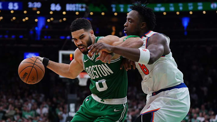 May 7, 2025; Boston, Massachusetts, USA; New York Knicks forward OG Anunoby (8) defends against Boston Celtics forward Jayson Tatum (0) in the fourth quarter during game two of the second round for the 2025 NBA Playoffs at TD Garden. Mandatory Credit: David Butler II-Imagn Images