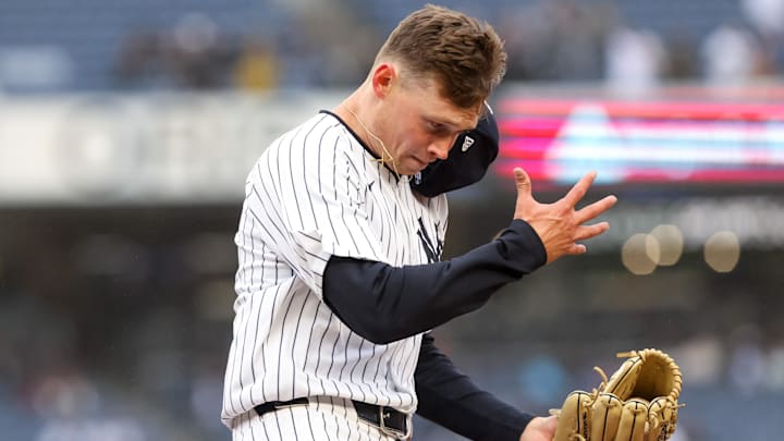 Apr 12, 2025; Bronx, New York, USA; New York Yankees pitcher Will Warren (98) reacts after covering first base for an out against the San Francisco Giants during the fourth inning at Yankee Stadium. Mandatory Credit: Tom Horak-Imagn Images