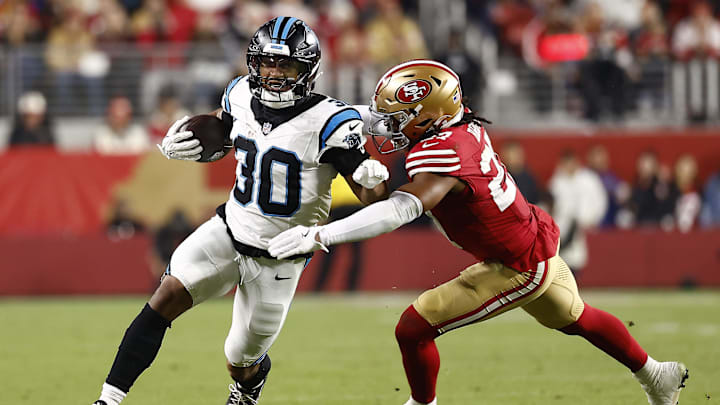 Nov 24, 2025; Santa Clara, California, USA; Carolina Panthers running back Chuba Hubbard (30) rushes the ball against San Francisco 49ers safety Ji'Ayir Brown (27) during the second half at Levi's Stadium. Mandatory Credit: Kelley L Cox-Imagn Images