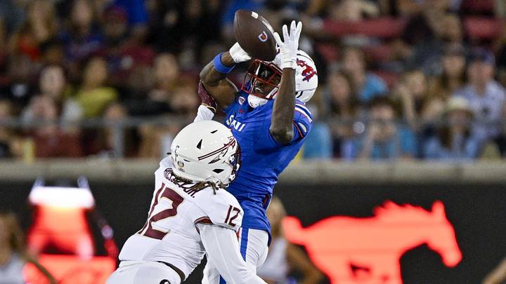 Sep 28, 2024; Dallas, Texas, USA; Southern Methodist Mustangs running back Brashard Smith (1) catches a pass for a first down against Florida State Seminoles defensive back Conrad Hussey (12) during the second half at Gerald J. Ford Stadium. Mandatory Credit: Jerome Miron-Imagn Images