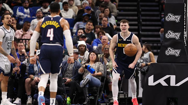 Jan 19, 2025; Orlando, Florida, USA; Denver Nuggets guard Christian Braun (0) celebrates after dunking the ball against the Orlando Magic in the third quarter at Kia Center. Mandatory Credit: Nathan Ray Seebeck-Imagn Images