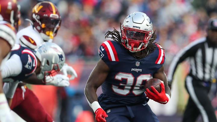 Nov 5, 2023; Foxborough, Massachusetts, USA; New England Patriots running back Rhamondre Stevenson (38) runs the ball during the second half against the Washington Commanders at Gillette Stadium. Mandatory Credit: Paul Rutherford-USA TODAY Sports