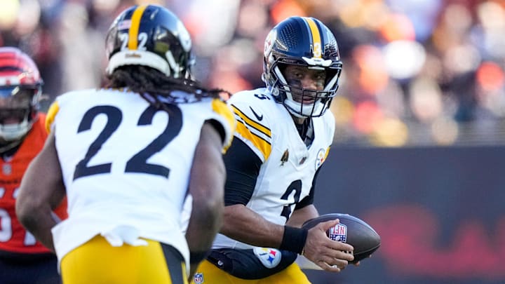 Pittsburgh Steelers quarterback Russell Wilson (3) hands off to running back Najee Harris (22) in the second quarter of the NFL Week 13 game between the Cincinnati Bengals and the Pittsburgh Steelers at Paycor Stadium in downtown Cincinnati on Sunday, Dec. 1, 2024.