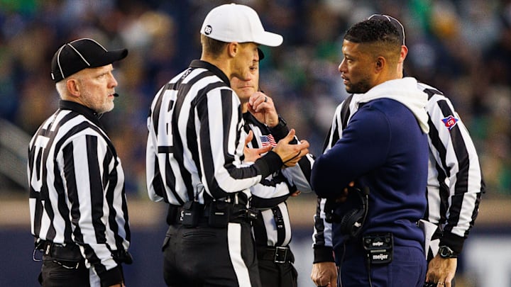 Notre Dame head coach Marcus Freeman speaks with officials during a NCAA college football game against Virginia at Notre Dame Stadium on Saturday, Nov. 16, 2024, in South Bend.