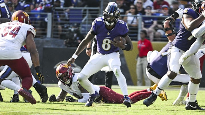 Oct 13, 2024; Baltimore, Maryland, USA;  Baltimore Ravens quarterback Lamar Jackson (8) rushes during the second half against the Washington Commanders at M&T Bank Stadium. Mandatory Credit: Tommy Gilligan-Imagn Images