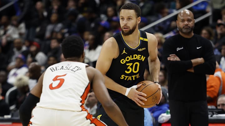 Jan 9, 2025; Detroit, Michigan, USA;  Golden State Warriors guard Stephen Curry (30) with the ball against Detroit Pistons guard Malik Beasley (5) in the second half at Little Caesars Arena. Mandatory Credit: Rick Osentoski-Imagn Images