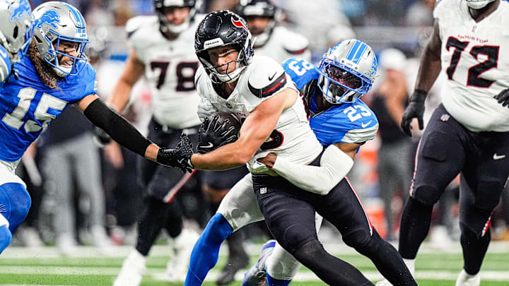 Detroit Lions cornerback Rock Ya-Sin (23) tackles Houston Texans tight end Harrison Bryant (88) during the first half at Ford Field in Detroit on Saturday, August 23, 2025.