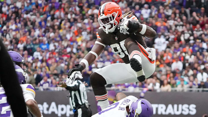 Oct 5, 2025; Tottenham, United Kingdom; Cleveland Browns tight end David Njoku (85) leaps over Minnesota Vikings linebacker Ivan Pace Jr. (0) during the third quarter of an NFL International Series game at Tottenham Hotspur Stadium. Mandatory Credit: Kirby Lee-Imagn Images