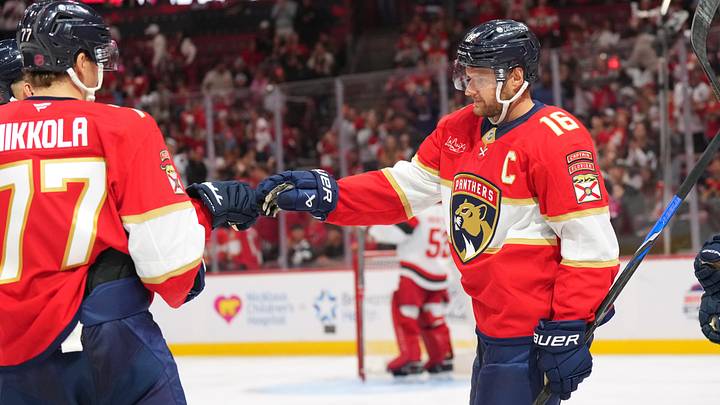 Florida Panthers Aleksander Barkov (16) celebrates his goal with Niko Mikkola (77) during the second period at Amerant Bank Arena.  Mandatory Credit: Jim Rassol-Imagn Images