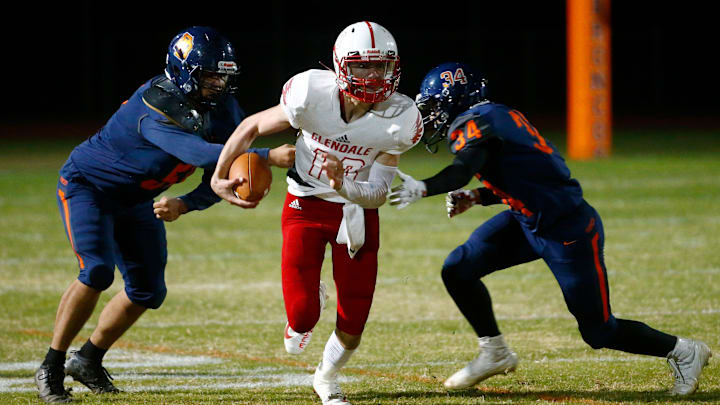 Glendale's Zech Owens (10) breaks a tackle from Poston Butte's Gaven Thrower (34) during the 4A Semifinal game at Poston Butte High School in San Tan Valley on Dec. 3, 2021.