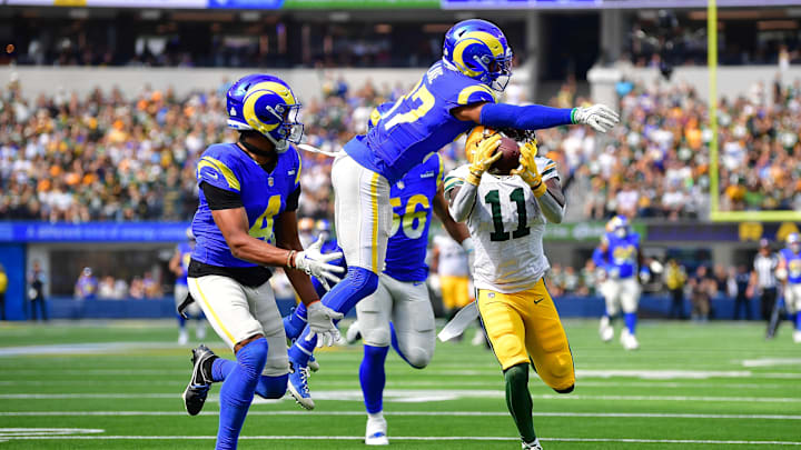 Green Bay Packers wide receiver Jayden Reed (11) catches a 53-yard pass against Los Angeles Rams safety Quentin Lake (37) .