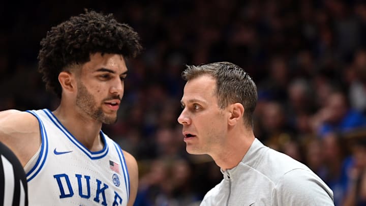 Jan 10, 2026; Durham, North Carolina, USA; Duke basketball forward Cameron Boozer (12) talks to head coach Jon Scheyer during the first half against the Southern Methodist Mustangs at Cameron Indoor Stadium.
