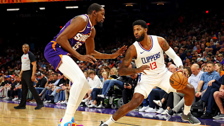 Apr 9, 2024; Phoenix, Arizona, USA; LA Clippers forward Paul George (13) handles the ball against Phoenix Suns forward Kevin Durant (35) during the first quarter at Footprint Center. Mandatory Credit: Mark J. Rebilas-Imagn Images Apr 9, 2024; Phoenix, Arizona, USA; LA Clippers forward Paul George (13) handles the ball against Phoenix Suns forward Kevin Durant (35) during the first quarter at Footprint Center. Mandatory Credit: Mark J. Rebilas-Imagn Images