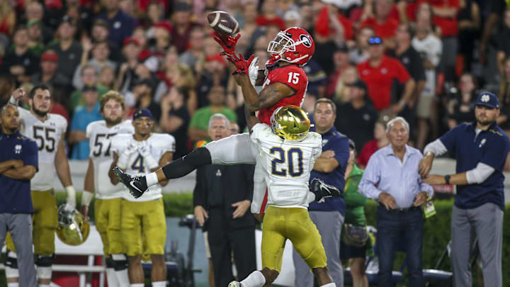 Sep 21, 2019; Athens, GA, USA; Georgia Bulldogs wide receiver Lawrence Cager (15) catches a pass over Notre Dame Fighting Irish cornerback Shaun Crawford (20) in the fourth quarter at Sanford Stadium. Mandatory Credit: Brett Davis-Imagn Images
Sep 21, 2019; Athens, GA, USA; Georgia Bulldogs wide receiver Lawrence Cager (15) catches a pass over Notre Dame Fighting Irish cornerback Shaun Crawford (20) in the fourth quarter at Sanford Stadium. Mandatory Credit: Brett Davis-Imagn Images