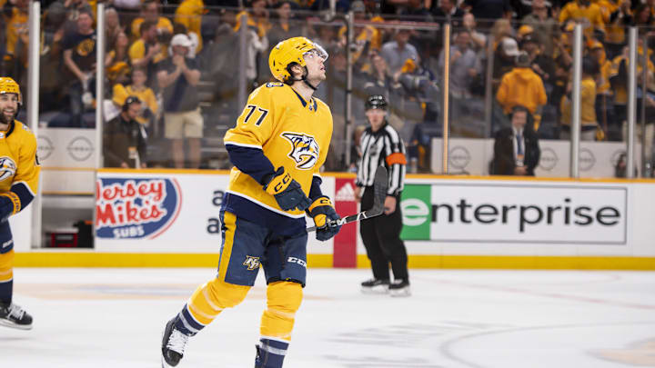 Apr 26, 2024; Nashville, Tennessee, USA; Nashville Predators right wing Luke Evangelista (77) celebrates his goal against the Vancouver Canucks during the third period in game three of the first round of the 2024 Stanley Cup Playoffs at Bridgestone Arena. Mandatory Credit: Steve Roberts-Imagn Images