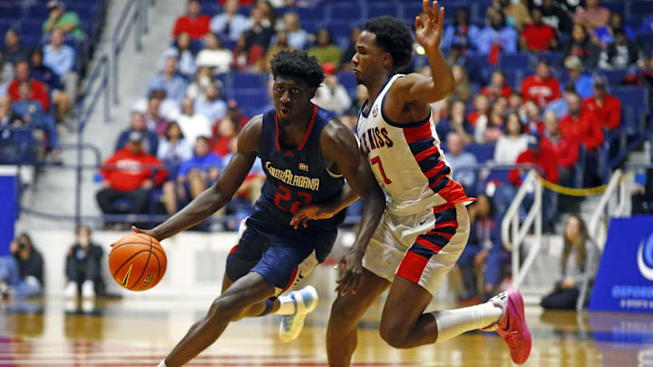 Nov 12, 2024; Oxford, Mississippi, USA; South Alabama Jaguars forward Barry Dunning Jr. (22) drives to the basket as Mississippi Rebels guard Davon Barnes (7) defends during the second half at C.M. 'Tad' Smith Coliseum. Mandatory Credit: Petre Thomas-Imagn Images